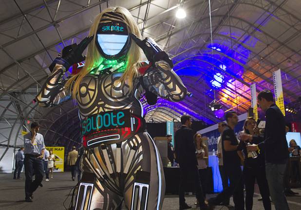 A woman in a robot costume draws attention to the Saloote booth during the Collision technology conference at the World Market Center Pavilions Wednesday, May 6, 2015. The Saloote App enables musicians to have digital video jam sessions on their smartphones.