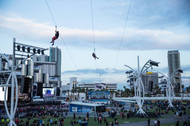 Festival-goers ride the zip-line at Rock in Rio Las Vegas, Friday May 8, 2015.