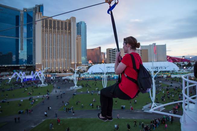 Festival-goers ride the zip-line at Rock in Rio Las Vegas, Friday May 8, 2015.