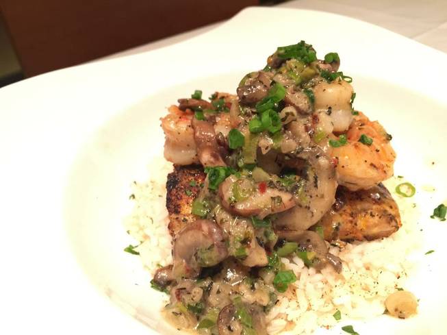 Pan-roasted Gulf grouper with shrimp Diane is being served during ...