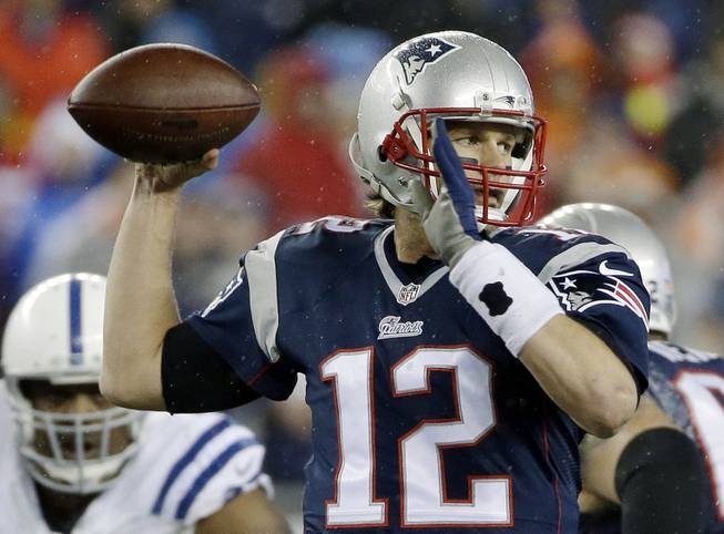 In this Jan. 18, 2015, photo, New England Patriots quarterback Tom Brady looks to pass during the first half of the AFC Championship game against the Indianapolis Colts in Foxborough, Mass.
