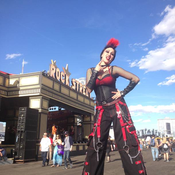 Las Vegas performer Melanie Kramer works Rock Street UK as a stilted dominatrix during Rock in Rio USA on Saturday.