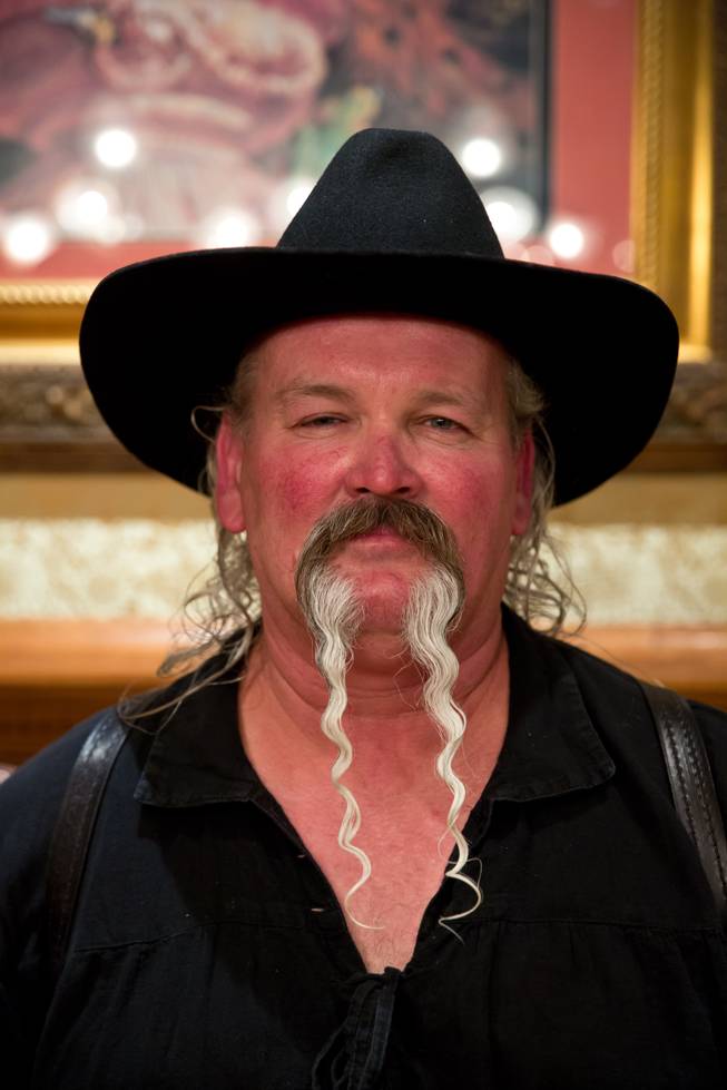 James Watson poses for a portrait after winning Longest Mustache at the Whiskerino Contest, a facial hair competition during the Las Vegas Elk's Helldorado Days, Sat May 16, 2015.
