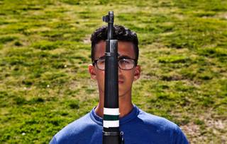 Palo Verde ROTC cadet Karim Hussein practices rifle drills with other members at the high school on Tuesday, May 19, 2015. He saved his dad from drowning in a freak accident in March and was awarded the ROTC
