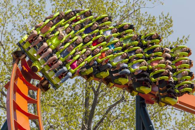 This photo provided by Cedar Point in Sandusky, Ohio, shows the theme park’s new Rougarou roller coaster. The floorless coaster has a werewolf theme. It’s one of a number of new attractions at theme parks around the country this summer.
