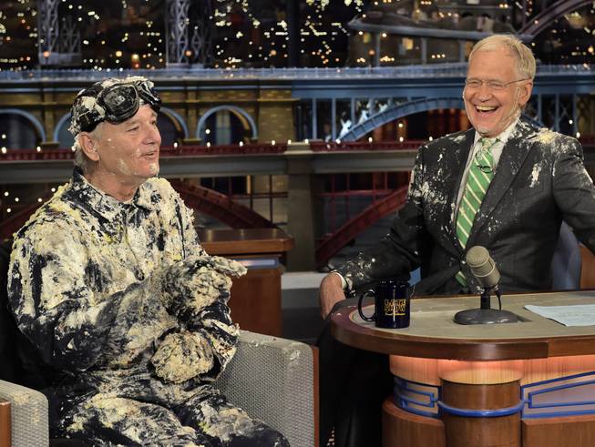 Actor Bill Murray talks with host David Letterman after emerging from a cake to say goodbye Tuesday, May 19, 2015, on the set of “The Late Show With David Letterman” in New York. Letterman’s final show airs Wednesday, May 20, 2015.