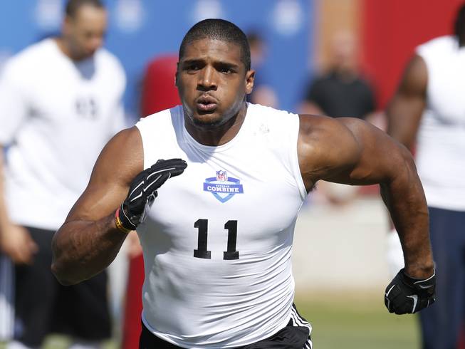 In this March 22, 2015, file photo, Michael Sam runs through a drill during the NFL Super Regional Combine football workout in Tempe, Ariz. The Montreal Alouettes have signed defensive end Michael Sam, the first openly gay player drafted in the NFL. The club says the free agent has agreed to a two-year deal.