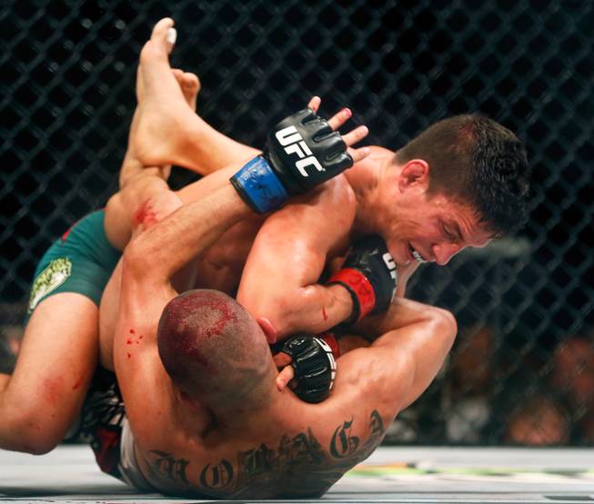 UFC flyweight contender Joseph Benavidez bloodies up contender John Moraga during their UFC 187 fight at the MGM Grand Garden Arena on Friday, May 22, 2015.