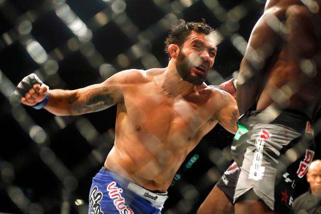 UFC middleweight contender Rafael Natal moves in to strike contender Uriah Hall during their UFC 187 fight at the MGM Grand Garden Arena on Friday, May 22, 2015.
