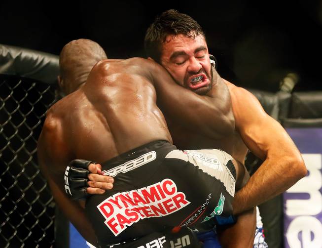 UFC middleweight contender Rafael Natal wraps up contender Uriah Hall during their UFC 187 fight at the MGM Grand Garden Arena on Friday, May 22, 2015.