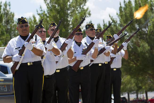 Members of the Disabled American Veterans (DAV) Chapter 12 honor guard, fire a 21-gun salute during a Memorial Day Ceremony at the Southern Nevada Veterans Memorial Cemetery in Boulder City Monday, May 24, 2015.