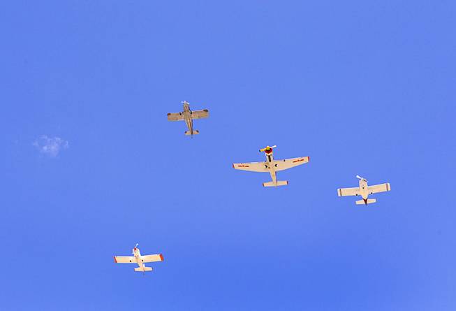 The Boulder City Veterans Pilot Group conducts a missing man formation flyover during a Memorial Day Ceremony at the Southern Nevada Veterans Memorial Cemetery in Boulder City Monday, May 24, 2015.