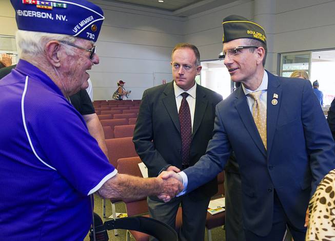 Ret. Major Robert Freeman, left, shakes hands with Congressman Joe Heck (R-Nev) following a Memorial Day Ceremony at the Southern Nevada Veterans Memorial Cemetery in Boulder City Monday, May 24, 2015.