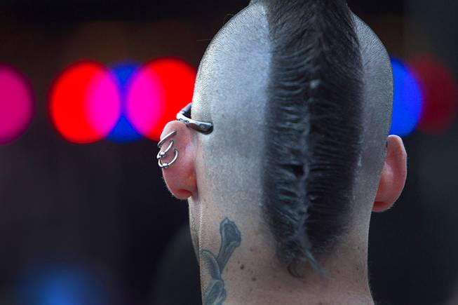 A fan listens to a band during the 17th annual Punk Rock Bowling & Music Festival in downtown Las Vegas Sunday, May 24, 2015.