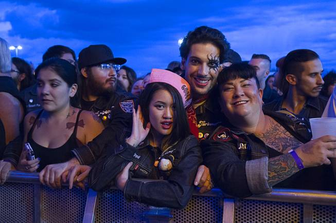 Fans pose for a photo as they wait for a band during the 17th annual Punk Rock Bowling & Music Festival in downtown Las Vegas Sunday, May 24, 2015.