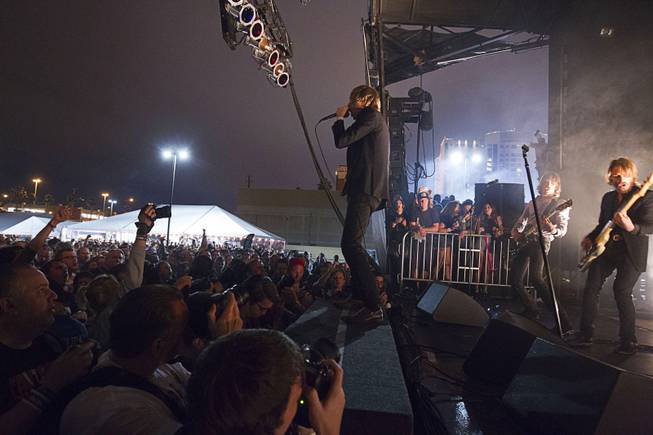 Dennis Lyxzen, center, of Refused, a Swedish punk band, performs during the 17th annual Punk Rock Bowling & Music Festival in downtown Las Vegas Sunday, May 24, 2015.