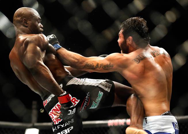 UFC middleweight contender Uriah Hall trades blows with opponent Rafael Natal during their UFC 187 fight at the MGM Grand Garden Arena on Friday, May 22, 2015.