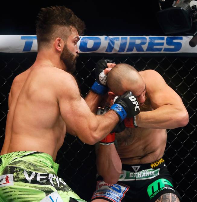 UFC heavyweight contender Andre Arlovski catches opponent Travis Browne off guard early in the first round with shots to the face during their UFC 187 fight at the MGM Grand Garden Arena on Friday, May 22, 2015.
