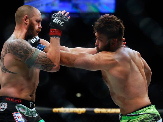 UFC heavyweight contender Andre Arlovski catches opponent Travis Browne with a punch to the throat during their UFC 187 fight at the MGM Grand Garden Arena on Friday, May 22, 2015.