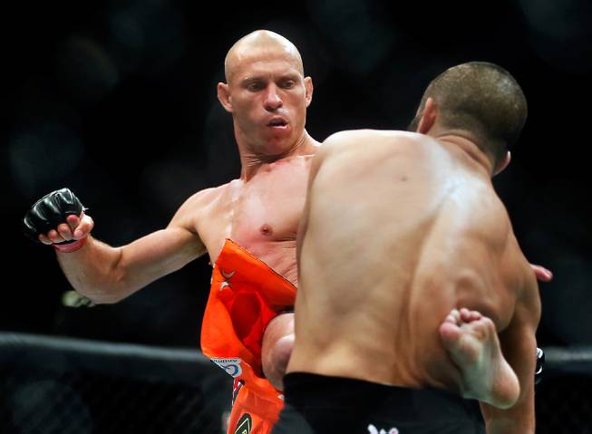UFC lightweight contender Donald Cerrone connects with a kick to the side of contender John Makdessi during their UFC 187 fight at the MGM Grand Garden Arena on Friday, May 22, 2015.
