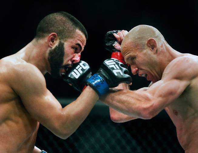 UFC lightweight contender Donald Cerrone connects with a punch to the face of contender John Makdessi during their UFC 187 fight at the MGM Grand Garden Arena on Friday, May 22, 2015.