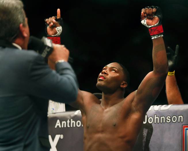UFC light heavyweight contender Anthony Johnson points to the heavens while being announced versus Daniel Cormier for their UFC 187 fight at the MGM Grand Garden Arena on Friday, May 22, 2015.