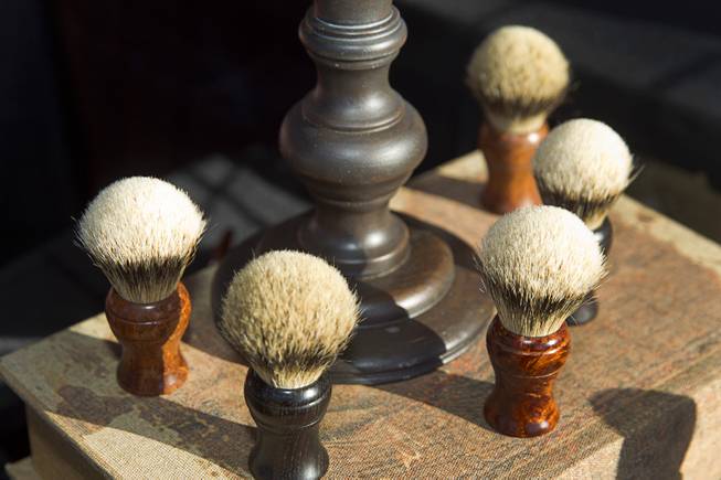 Shaving cream brushes are displayed at the Tusk & Hide booth in a vendor area of the Punk Rock Bowling & Music Festival in downtown Las Vegas Monday, May 25, 2015.