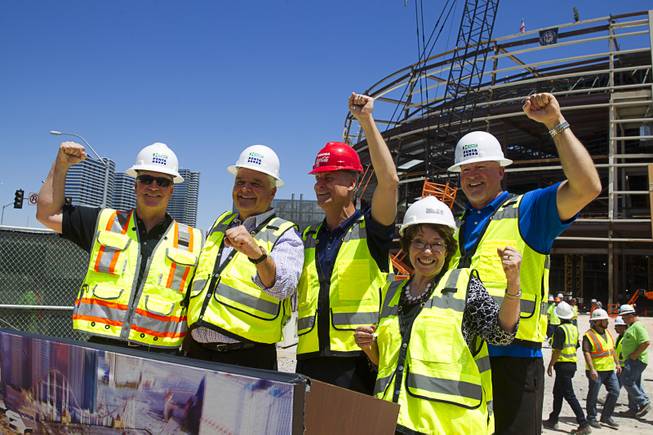 Officials pose for a photo during a topping off ceremony for the Las Vegas Arena Wednesday, May 27, 2015. From left:   Monte Thurmond, project executive for Hunt-Penta Joint Venture, Clark County Commission Chairman Steve Sisolak, Mark Faber, senior vice president, Global Partnership, AEG, Commissioner Mary Beth Scow and Mark Prows, senior vice president of arenas for MGM Resorts International.The $375 million arena is scheduled to open in Spring 2016.