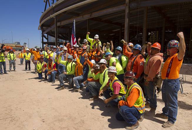 Ironworkers pose for a photo during a topping off ceremony for the Las Vegas Arena Wednesday, May 27, 2015. Representatives from MGM Resorts International and AEG, contractors Hunt-Penta and elected officials were on hand to celebrate the installation of the arena's final steel beam. The $375 million arena is scheduled to open in Spring 2016.