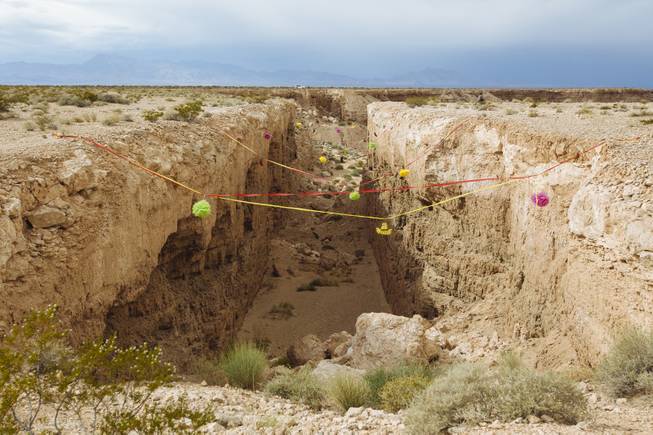 Justin Favela's Family Fiesta at Michael Heizer's Double Negative located in the Moapa Valley on Mormon Mesa near Overton, Nevada on May 9, 2015.