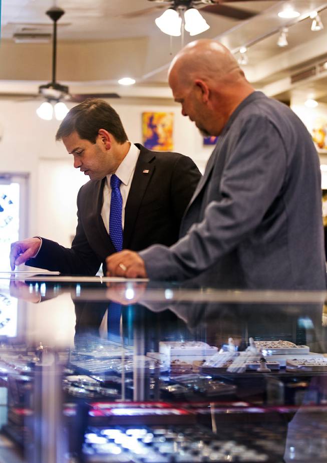 GOP Presidential candidate Marco Rubio talks about some of the interesting merchandise with Rick Harrison of the World Famous Gold & Silver Pawn Shop during his first visit here as declared candidate on Thursday, May 28, 2015.