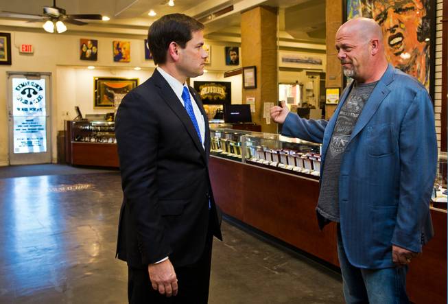 GOP Presidential candidate Marco Rubio talks about some of the interesting merchandise with Rick Harrison of the World Famous Gold & Silver Pawn Shop during his first visit here as declared candidate on Thursday, May 28, 2015.