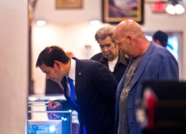GOP Presidential candidate Marco Rubio checks out some of the interesting merchandise joined by Richard Benjamin Harrison and son Rick Harrison with the World Famous Gold & Silver Pawn Shop during his first visit here as declared candidate on Thursday, May 28, 2015.