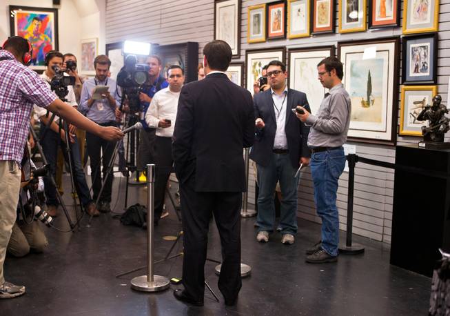 GOP Presidential candidate Marco Rubio speaks to the media while stopping at the World Famous Gold & Silver Pawn Shop with Rick Harrison during his first visit here as declared candidate on Thursday, May 28, 2015.
