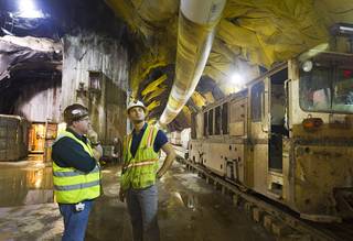 Jim Nickerson, project manager, talks with Claudio Cimiotti, senior tunnel engineer, before a media tour of the third intake tunnel at Lake Mead Monday, June 1, 2015.