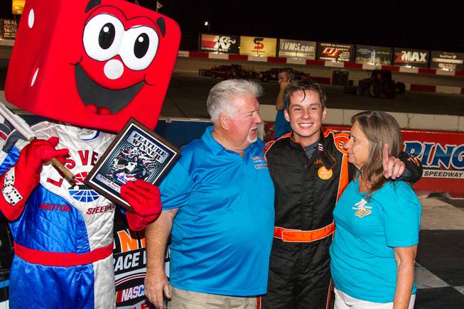 Chris Trickle celebrates in victory lane with his parents, Chuck and Barbara Trickle, after winning his first NASCAR Super Late Model feature Oct. 4, 2014, during the NASCAR Whelen All-American Series Season Championship Night at the Bullring at Las Vegas Motor Speedway.