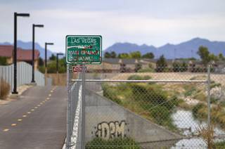 Graffiti is shown along the Las Vegas Wash channel near Pecos Road and Lake Mead Boulevard Tuesday, June 9, 2015.
