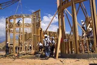 Carpenters work on a home in the Ridges Las Vegas, a luxury residential community in Summerlin, Thursday, June 11, 2015.