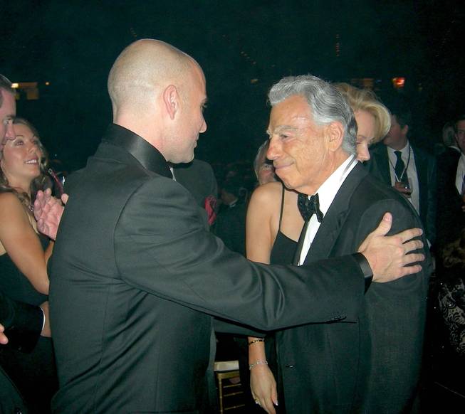 Andre Agassi, left, greets Kirk Kerkorian in 2011 at the Andre Agassi Foundation for Education Grand Slam for Children fundraiser, where Kerkorian donated $18 million to the foundation.