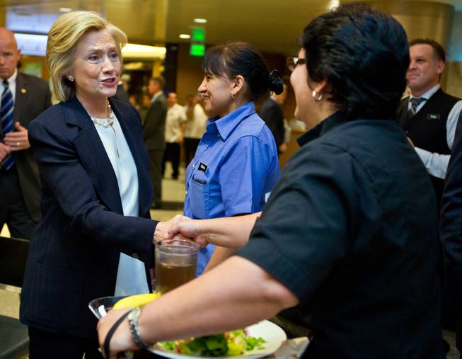 Presidential candidate Hillary Clinton arrives at the Aria and greets workers before speaking at the NALEO conference on Thursday, June 18, 2015.