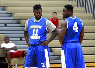 Jordan Cornish, left, talks with Ike Nwamu during a Desert Reign league game at Canarelli Middle School Monday, June 22, 2015.