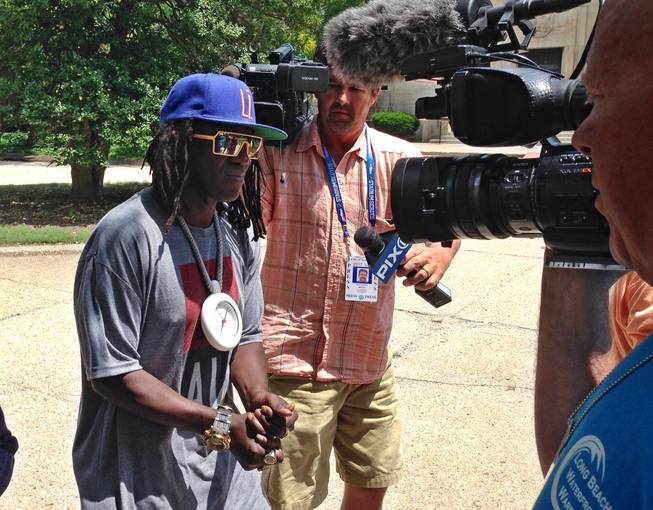 Rapper and entertainer Flavor Flav leaves a Nassau County courthouse, Tuesday, June 23, 2015, in Mineola, N.Y. Flav's May arrest in Las Vegas on allegations he was speeding and driving under the influence has delayed an expected settlement in a New York case on similar charges. 
