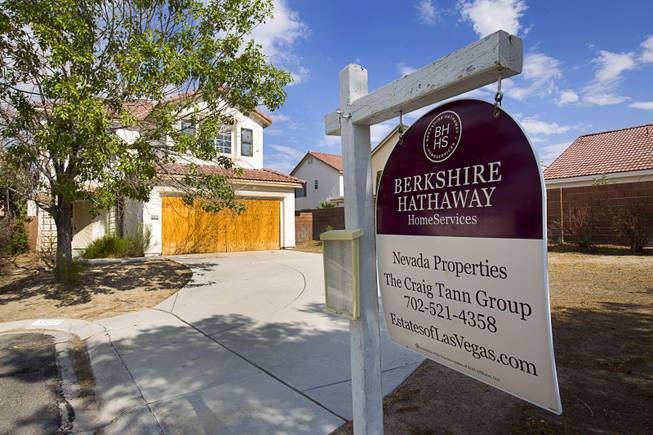 A foreclosed home is shown in a neighborhood near Tenaya Way and Russell Road on Thursday, June 25, 2015.