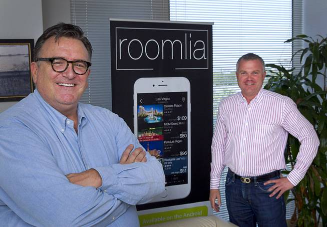 Jim Ferguson, left, and Michael Reichartz, co-founders of Roomlia, pose in the company's offices Thursday, June 25, 2015. Roomlia is a mobile hotel booking app for iPhone and Android devices.
