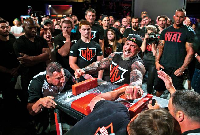 Ron Bath of Canton, Ga., puts Dickey Spiroff of Homestead, Fla., to the test during the World Armwrestling League's Las Vegas regional at the UNLV Cox Pavilion on Saturday, May 30, 2015.