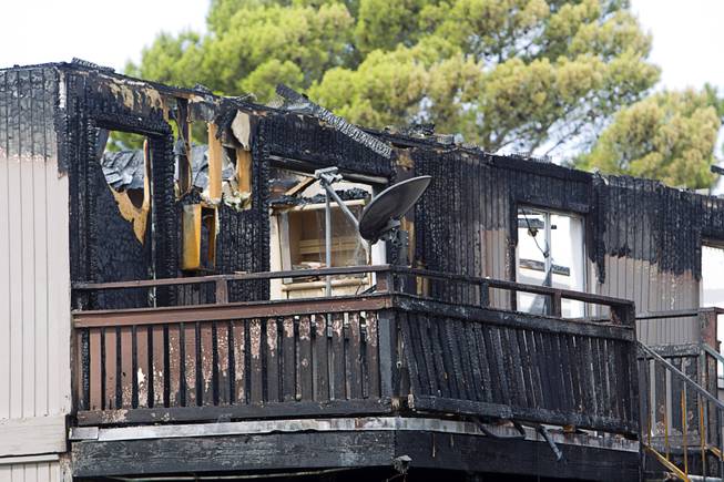 An apartment is shown after an early morning three-alarm fire at the Sandpebble Village apartments at Arville Street and Sirius Avenue Sunday, June 28, 2015.