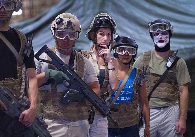 Participants line up for instruction before an operation at Adventure Combat Ops, 4375 S. Valley View Blvd., Monday, June 29, 2015. The zombie-apocalypse-combat experience opens on July 2.