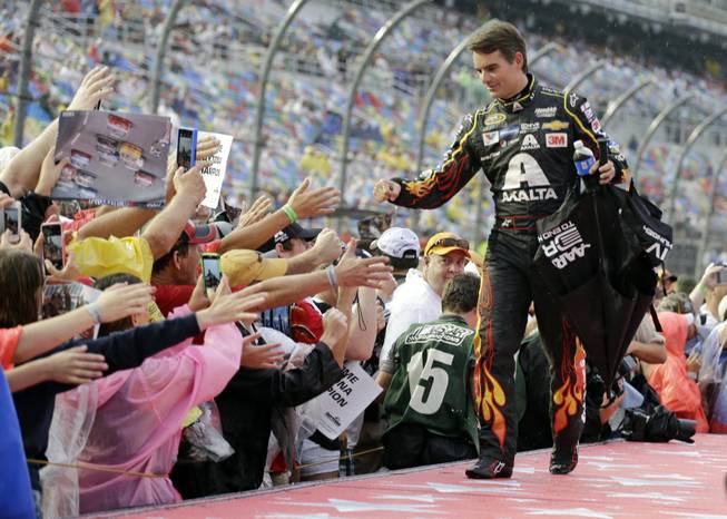 Jeff Gordon greets fans during driver introductions before the Daytona 500 at Daytona International Speedway on Sunday, July 5, 2015, in Daytona Beach, Fla. Gordon is retiring at the end of the season, and this will be his last race at Daytona.