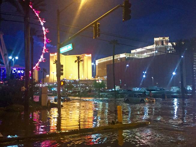 Flooding is shown just north of Flamingo Road near the Linq on Monday, July 6, 2015. Koval Road was closed, and several cars were seen stranded in the area.