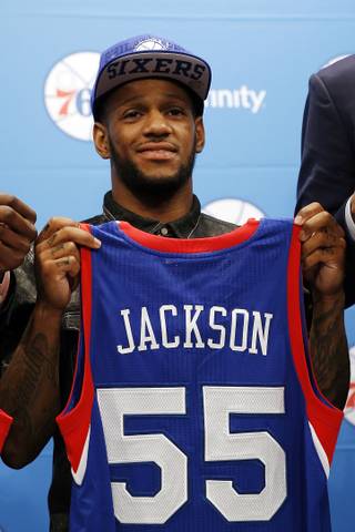 Newly drafted Philadelphia 76ers' Pierre Jackson poses for a photo after a basketball news conference at the team's practice facility, Saturday, June 28, 2014, in Philadelphia. 